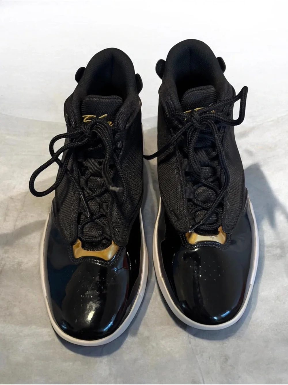 Jordan Kids Black and Gold High-Top Sneakers